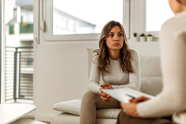 woman in therapy session with psychologist