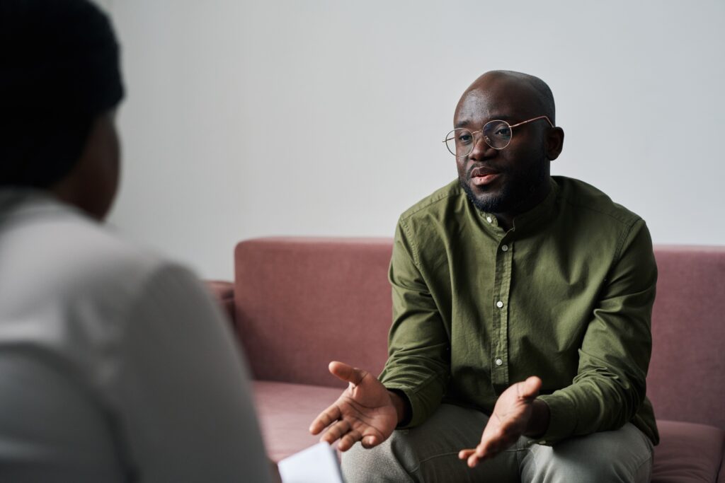 man speaking to therapist in Clifton